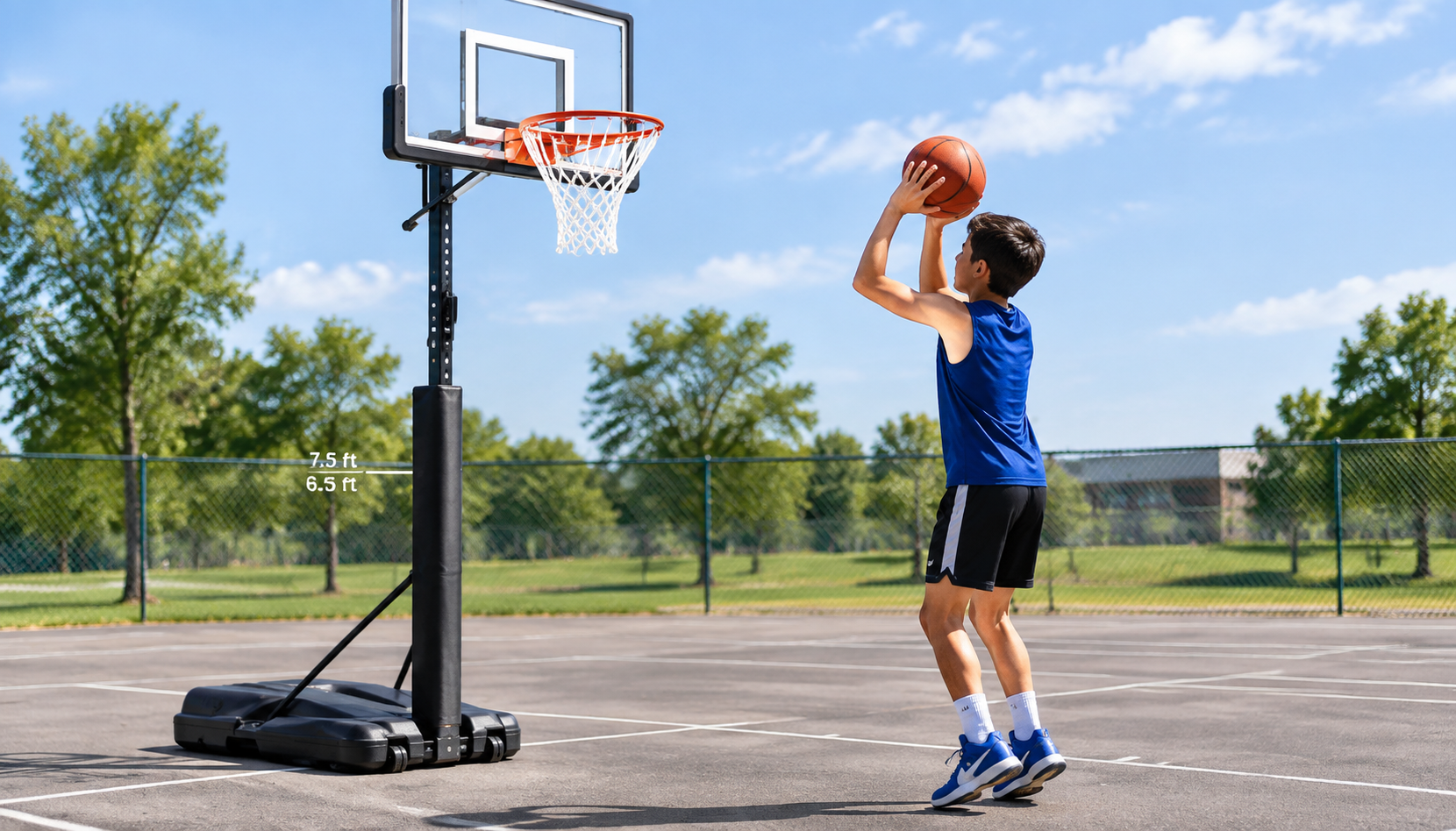 Youth basketball player training on an adjustable sports hoop set to developmental rim height